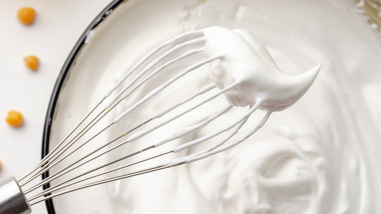 whipped aquafaba on whisk