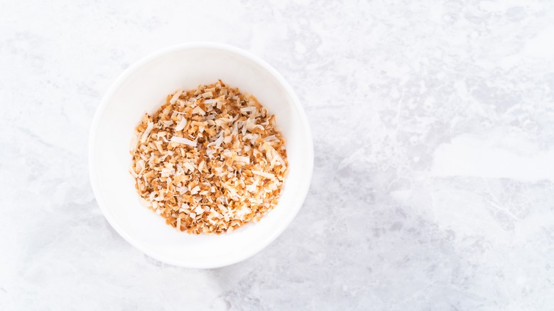 toasted coconut flakes in bowl