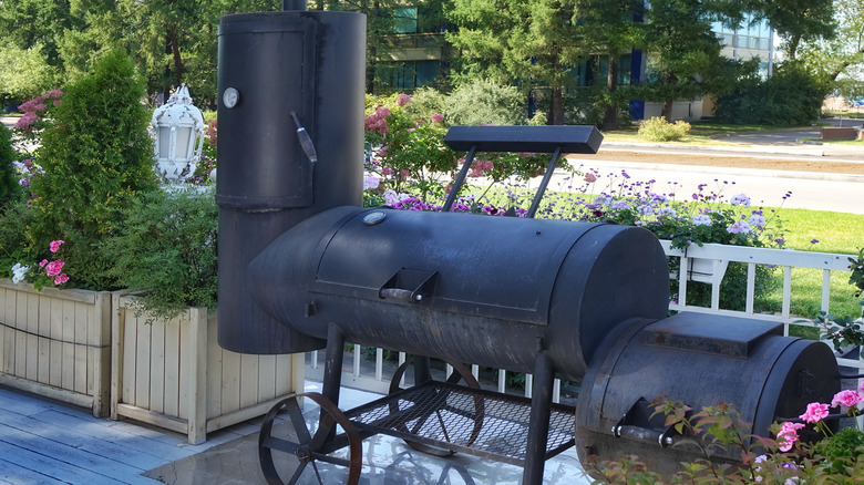 offset barbecue grill on porch