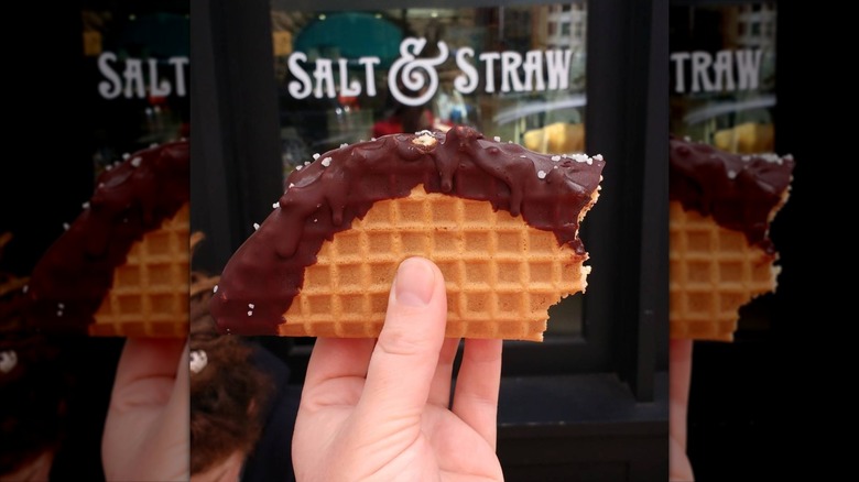 hand holding Salt & Straw Chocolate Tacolate