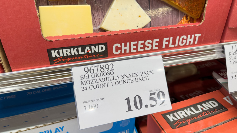 A box of Kirkland Signature cheese with a price tag