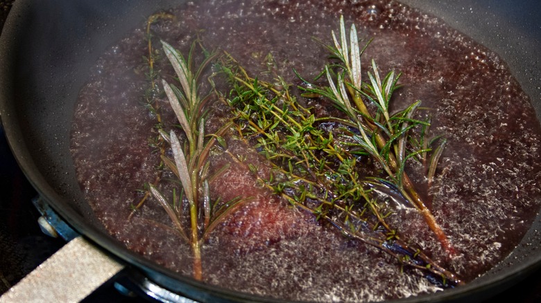 deglazing pan with herbs