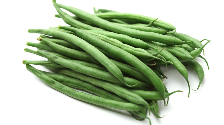 Whole green beans white background 