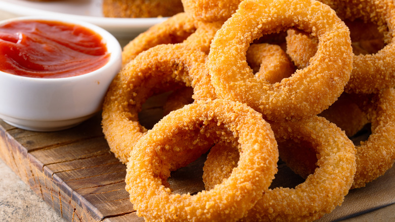 onion rings on a wood cutting board