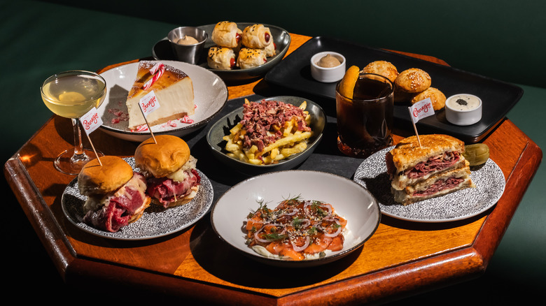 Carnegie Deli dishes with cocktails