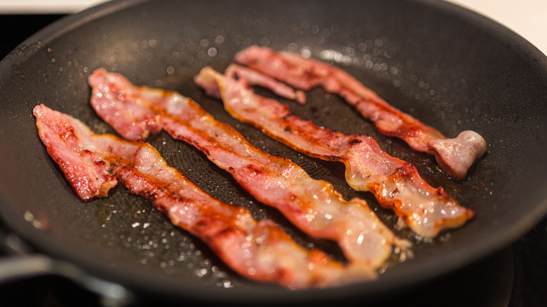 Bacon frying in a pan