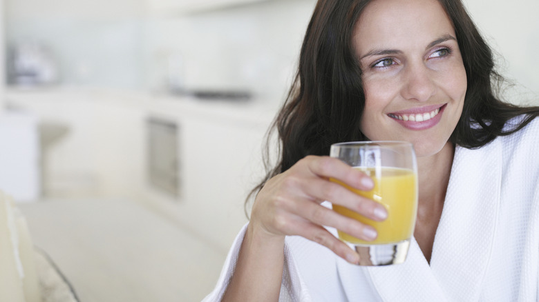 woman drinking juice