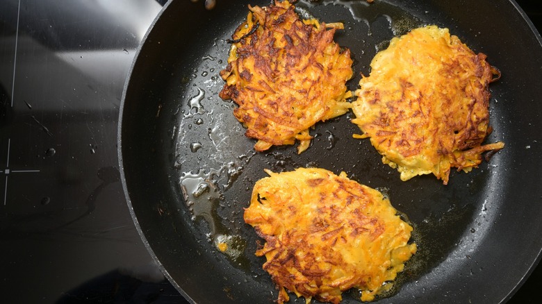 vegetable fritters in a black pan