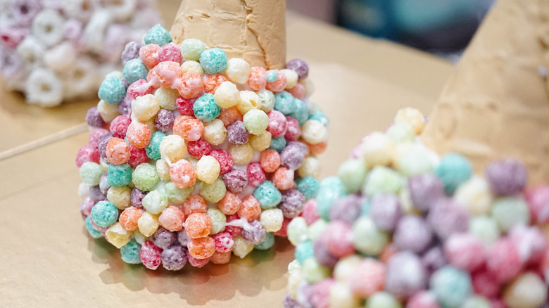 Colorful cereal on ice cream cone