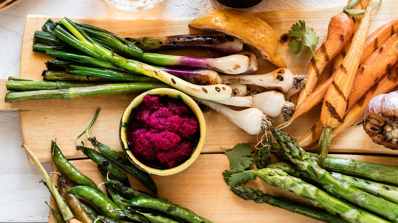 Platter of grilled spring onions and veggies