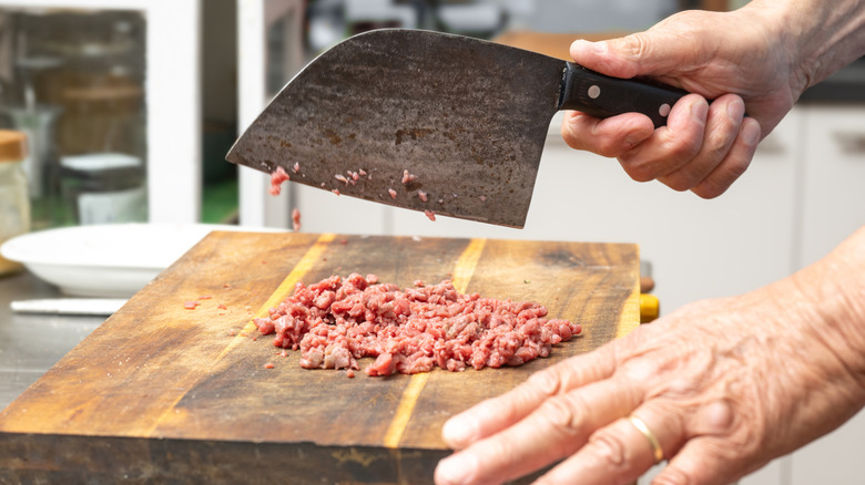 Grinding beef with cleaver