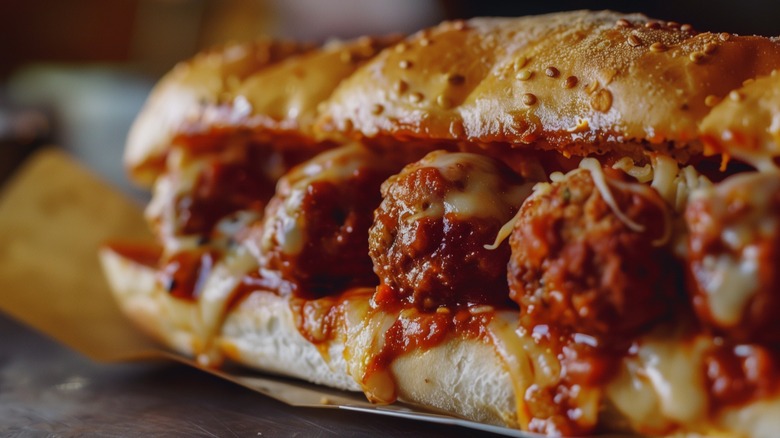 Close-up of a meatball marinara sub sandwich