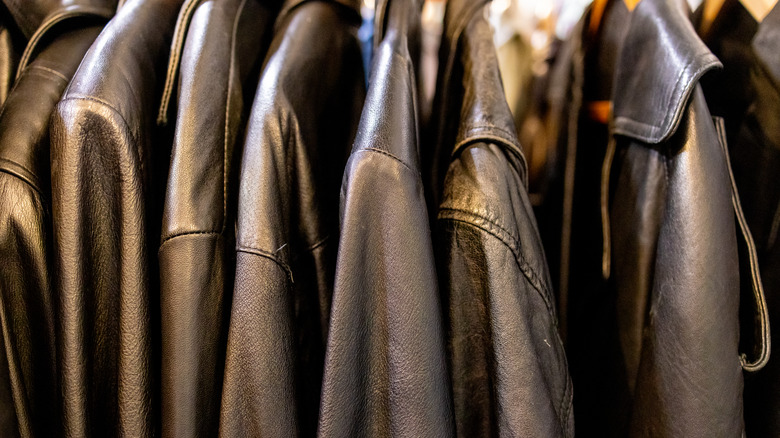 row of hanging leather jackets