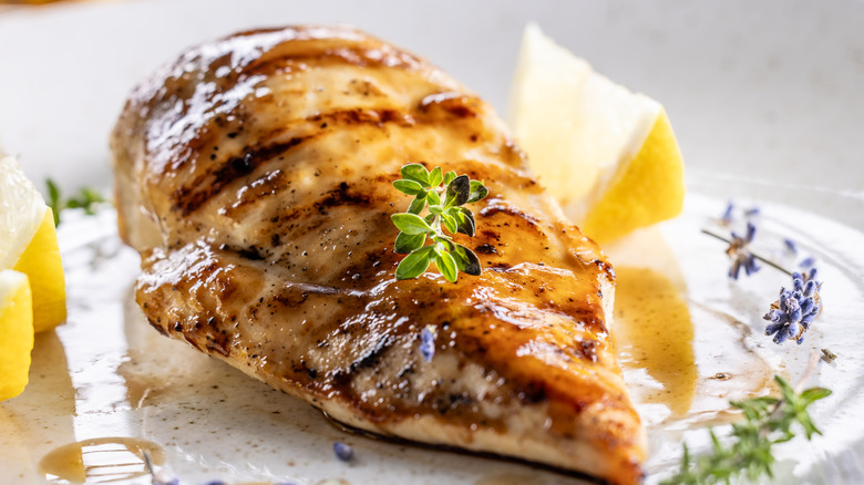 A cooked chicken breast on a dinner plate