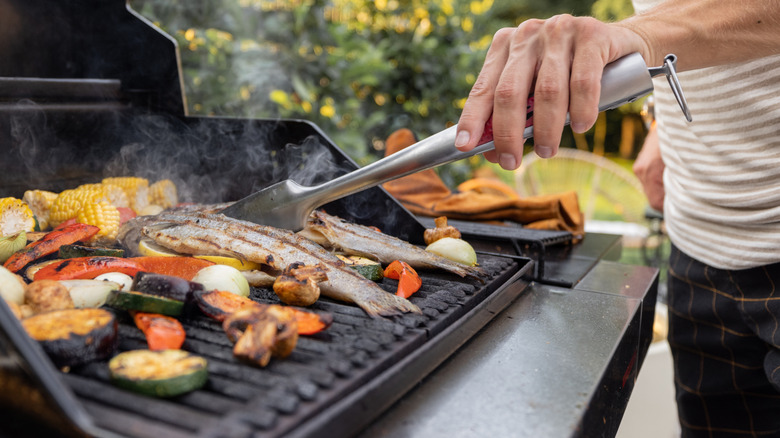 Man grilling fish