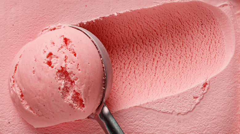 Strawberry ice cream ball in spoon