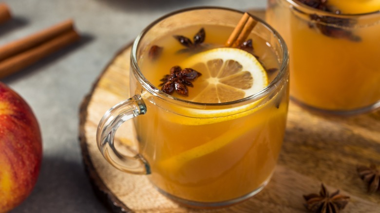 Mug of apple cider with lemon slices