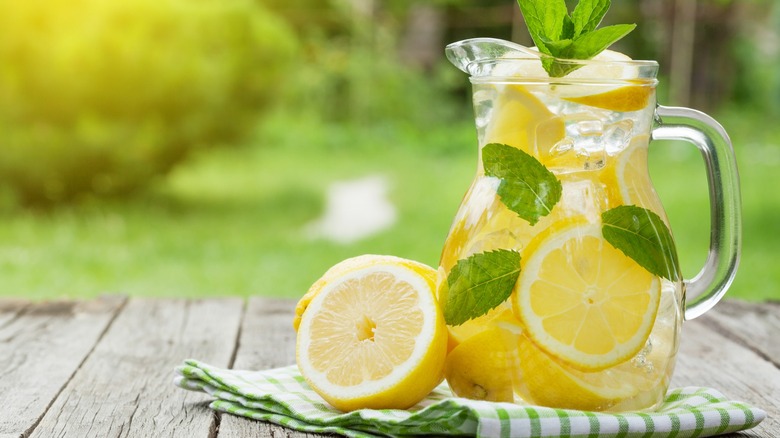 A pitcher of lemonade outside