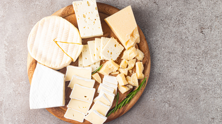 Fancy cheeses on a charcuterie board