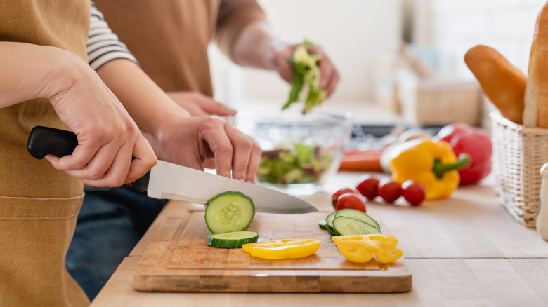 Cooks chopping vegetables