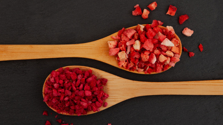 Freeze-dried strawberries and raspberries chopped and on wooden spoons