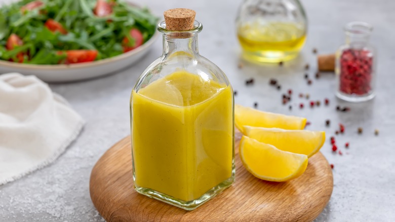 yellow sauce in glass jar