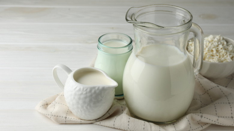 Different dairy products on wood table