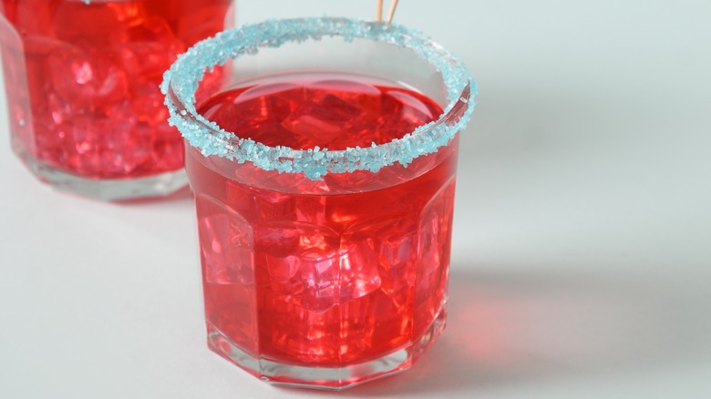 Blue rim on red drink