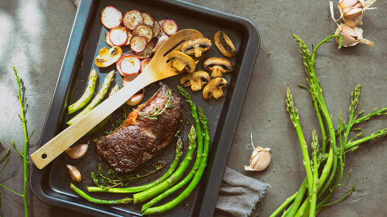 Steak and vegetables on sheet pan