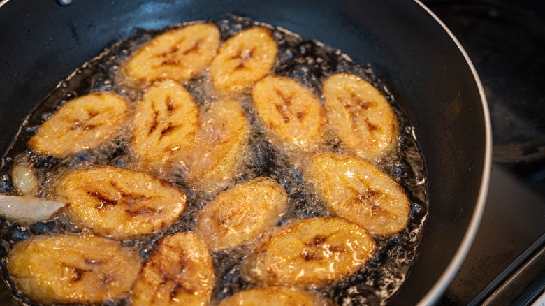 deep frying plantains in a skillet