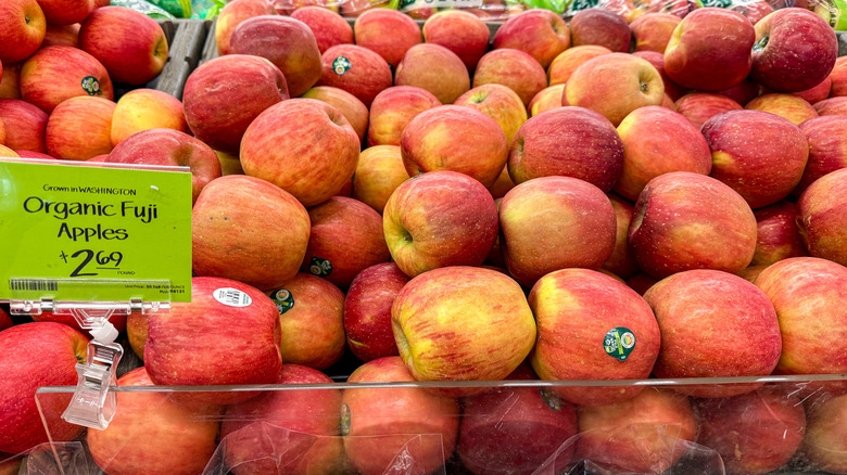 A pile of red apples is displayed at Whole Foods.