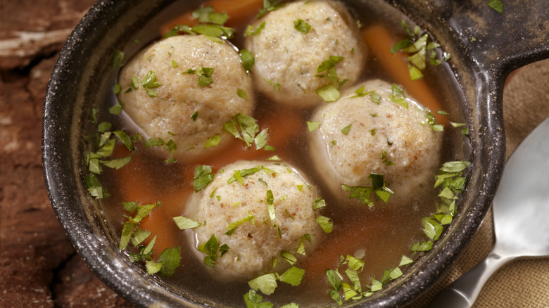 Matzah ball soup dumplings made from a mixture of matzah meal, eggs, water, and chicken fat