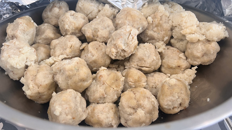 Matzo balls in a bowl on a table