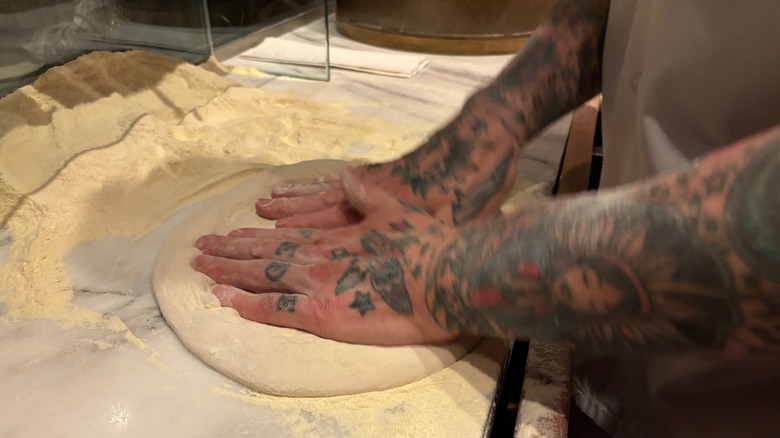 Hands working dough