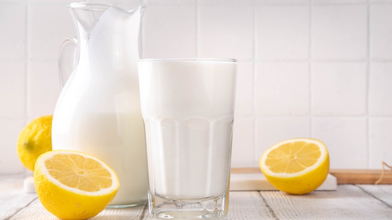 Cups of buttermilk on table