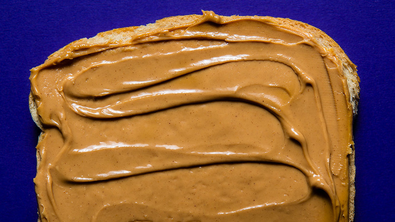 https://www.tastingtable.com/img/gallery/how-to-mix-natural-peanut-butter-beater/image-import.jpg