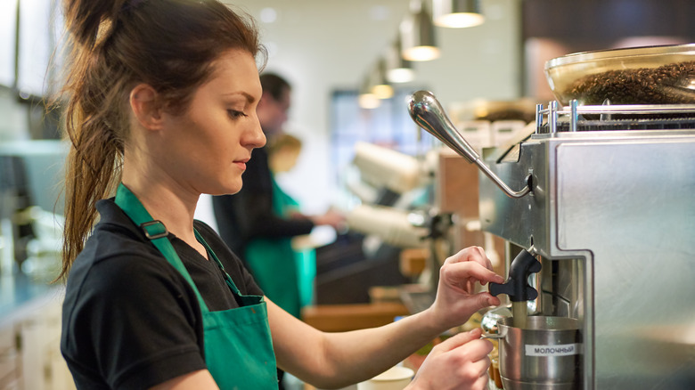 a barista making coffee