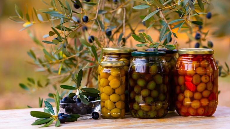 jars with olives outdoors