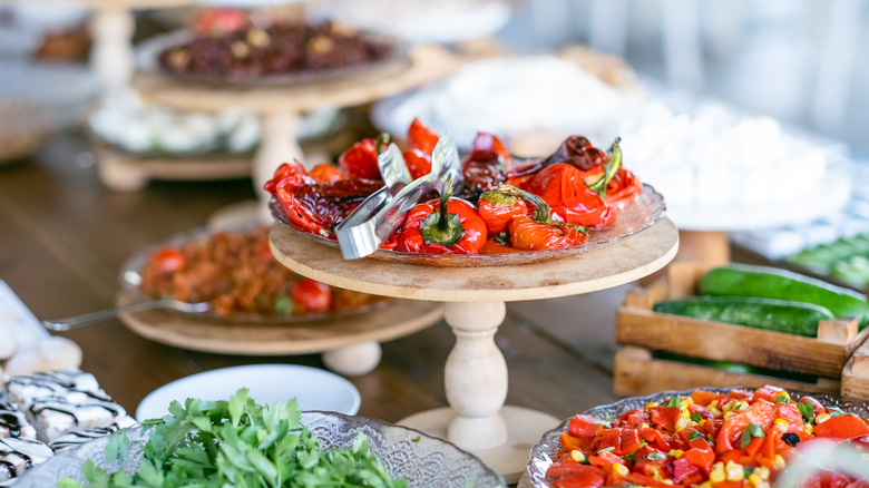 Trays of salads on buffet table