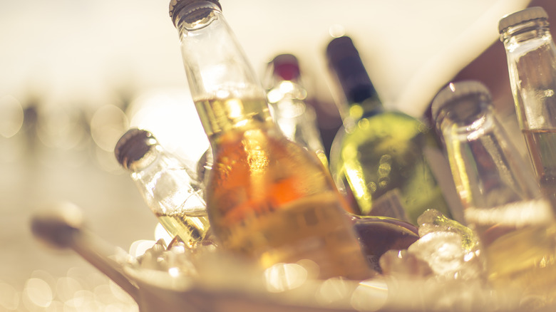 Close-up of a variety of bottled drinks in ice