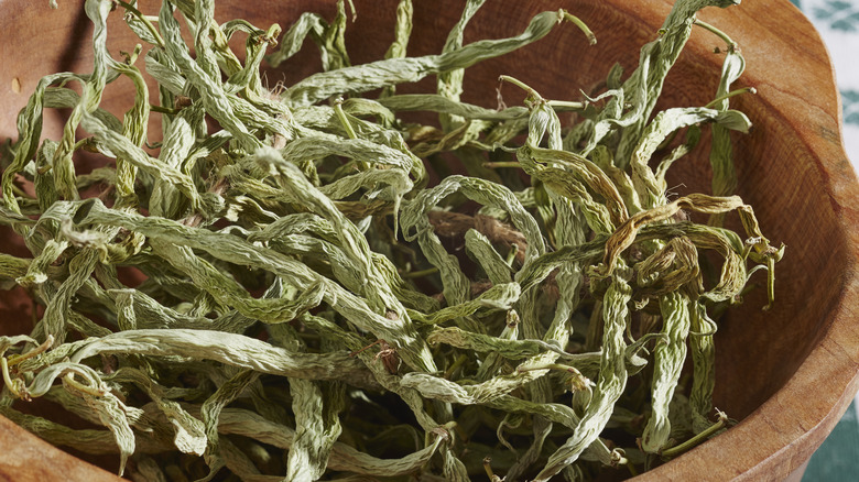 Dehydrated green beans in a wooden bowl