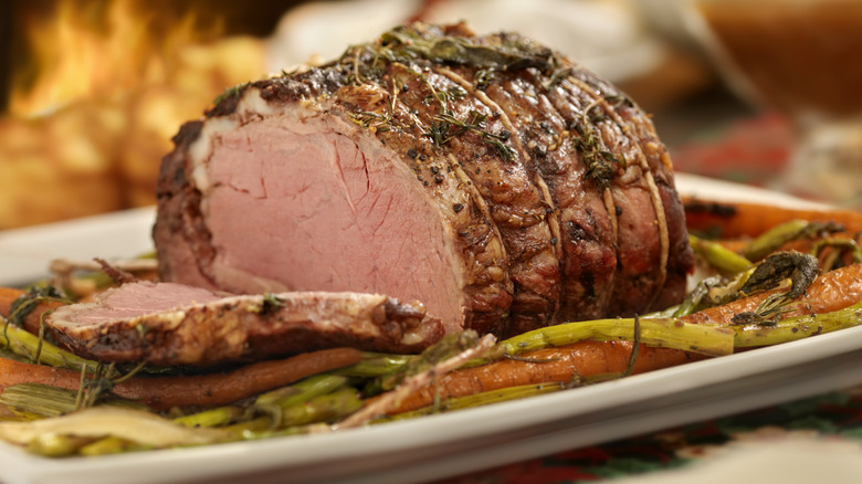 roast beef  and vegetables on platter