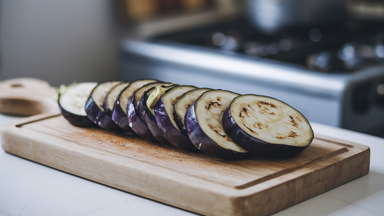 Sliced eggplant on cutting board