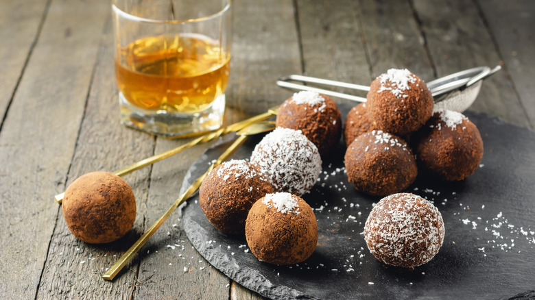 Bourbon balls with glass of bourbon