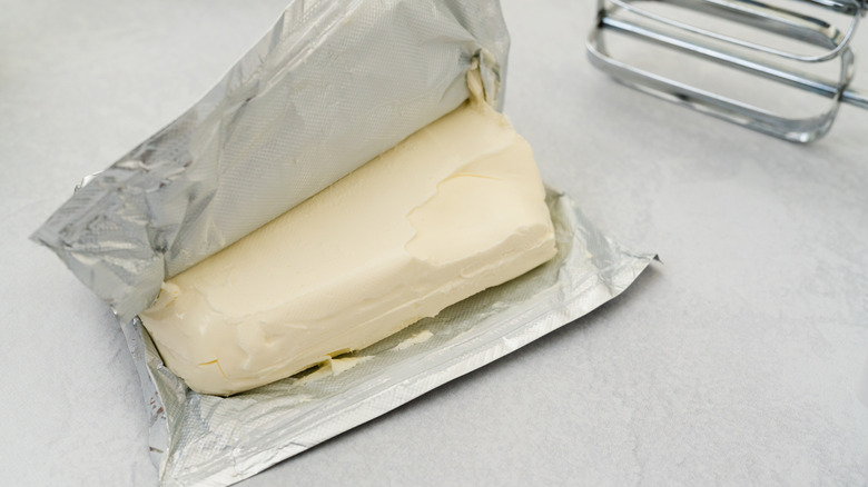 Block of opened cream cheese