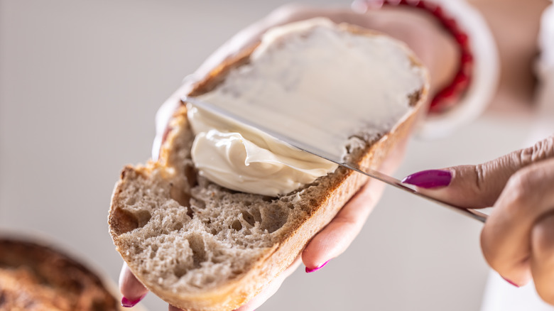 Cream cheese spread on a slice of bread