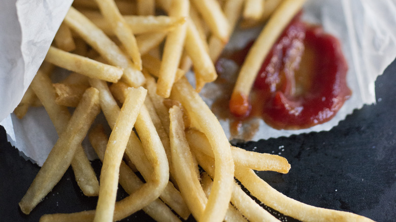 Takeout french fries with ketchup