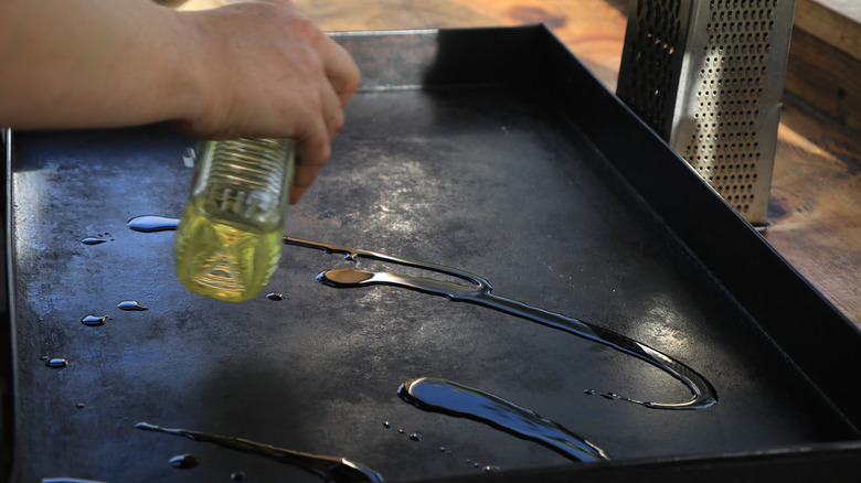 pouring oil on blackstone griddle