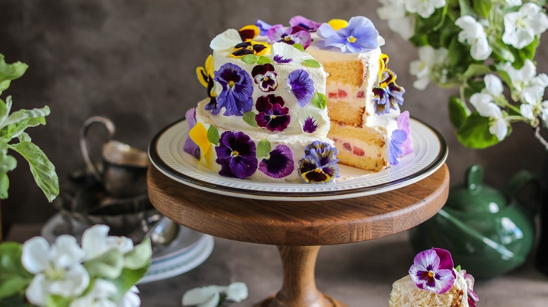 Cake decorated with purple pansies