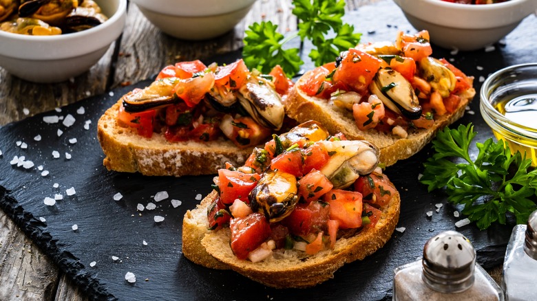 mussels and tomatoes on toast